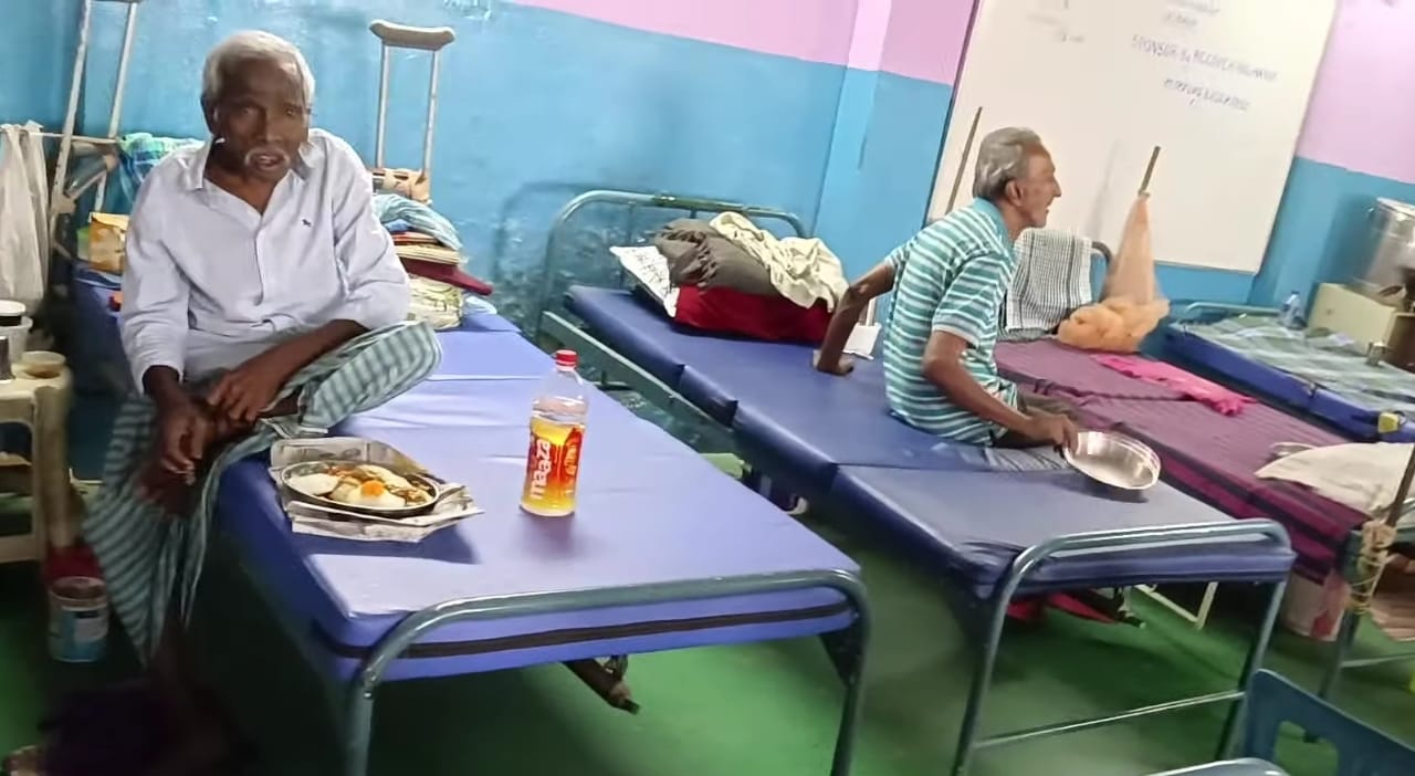 Elderly residents resting and eating at a Recovering Hands shelter